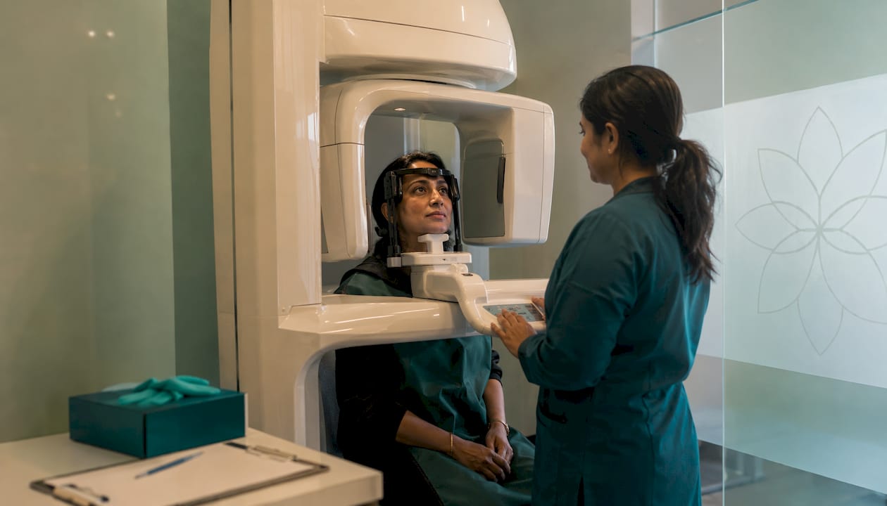 Patient undergoing CBCT dental scan in clinic